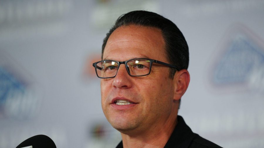 Pennsylvania Governor Josh Shapiro, wearing dark-framed glasses, speaks beside a microphone.