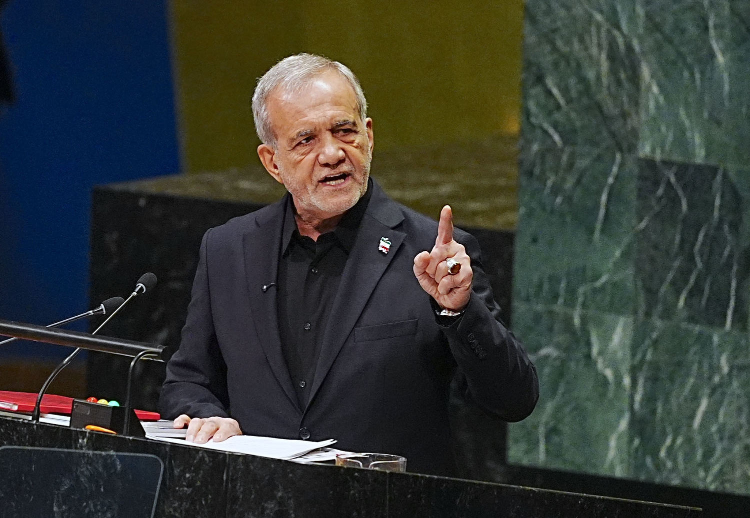 Pezeshkian speaks at the UN General Assembly podium.